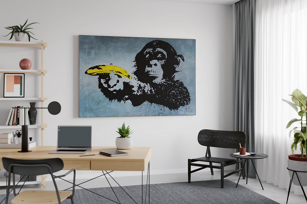 Banksys Bild Affe mit gelber Banane als Wandgemälde