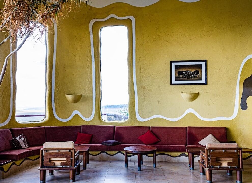 adding depth with texture in color yellow wall and red sofa living space